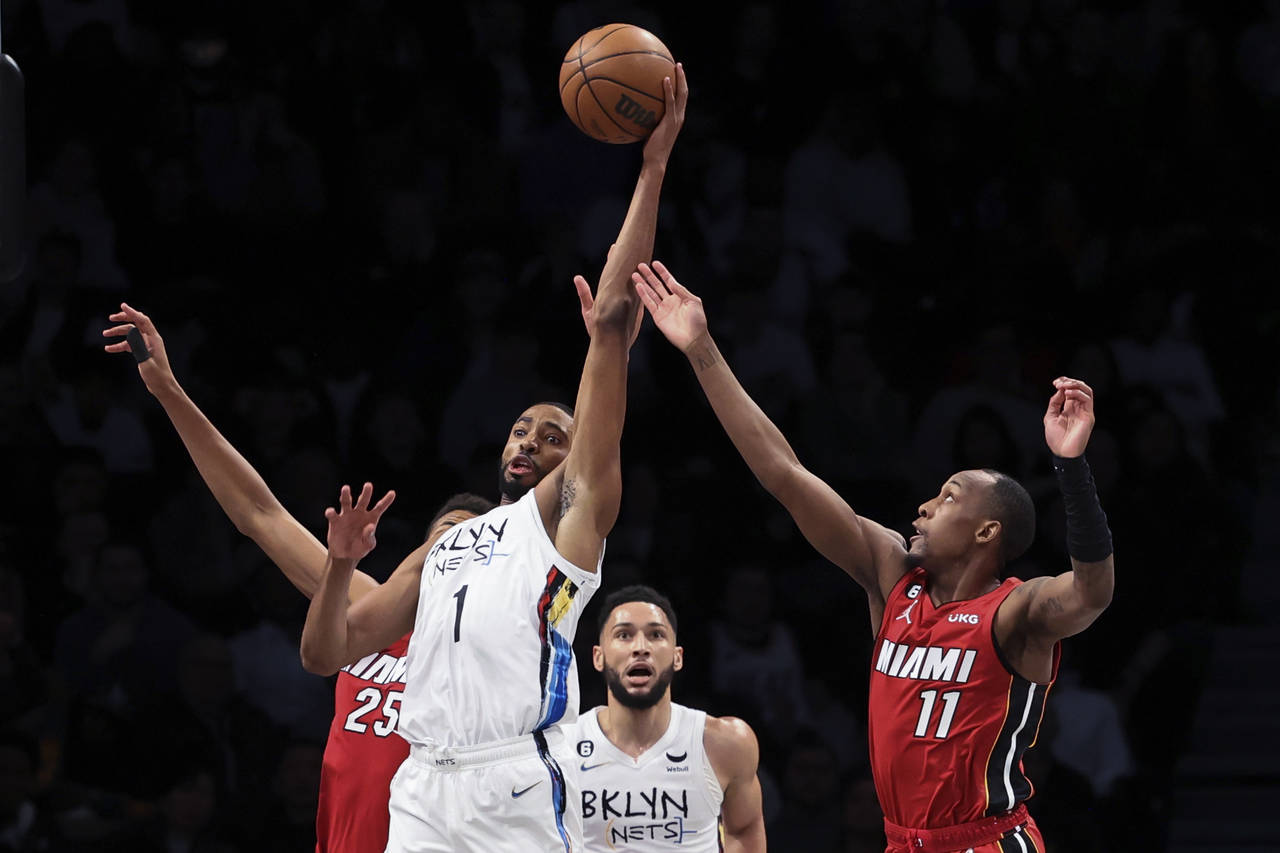 Brooklyn Nets forward Mikal Bridges (1) looks to pass the ball as Miami Heat center Orlando Robinso...
