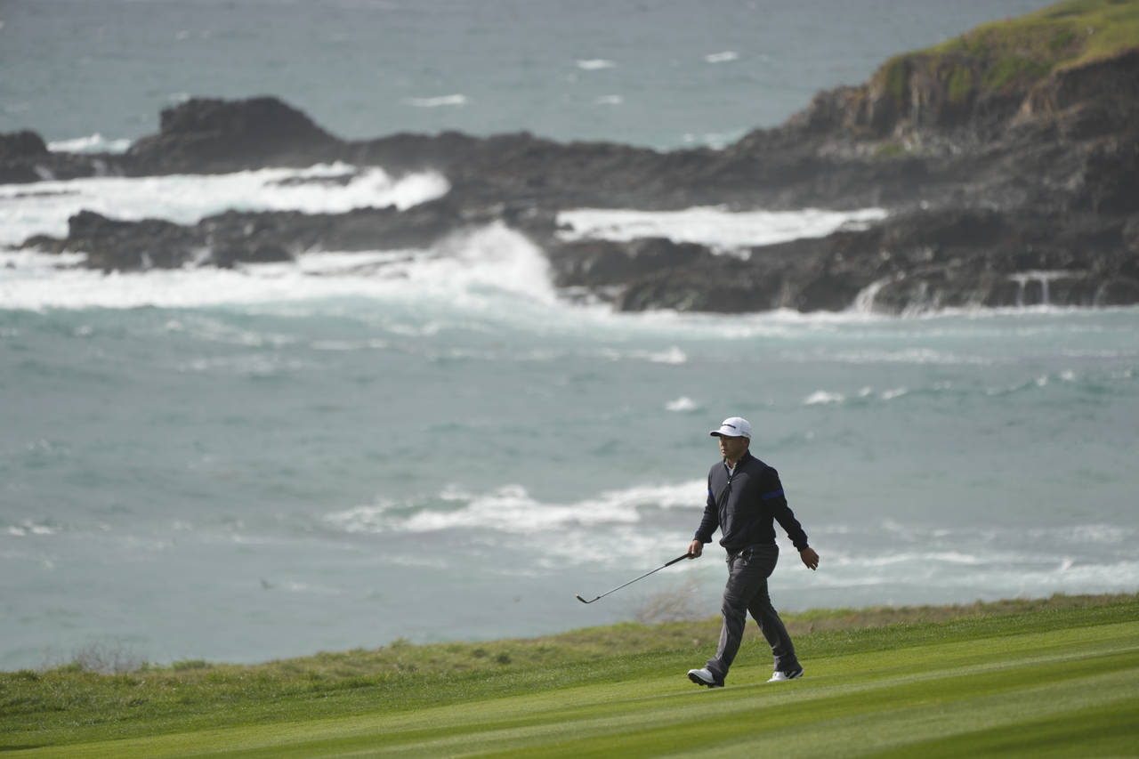 Kurt Kitayama walks down the ninth fairway of the Pebble Beach Golf Links during the second round o...