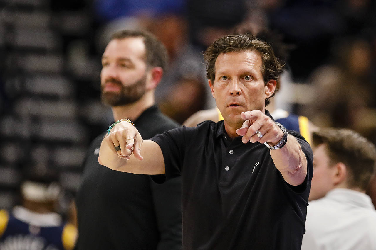 FILE - Utah Jazz Head Coach Quinn Snyder gives instructions to his team during the first half of an...