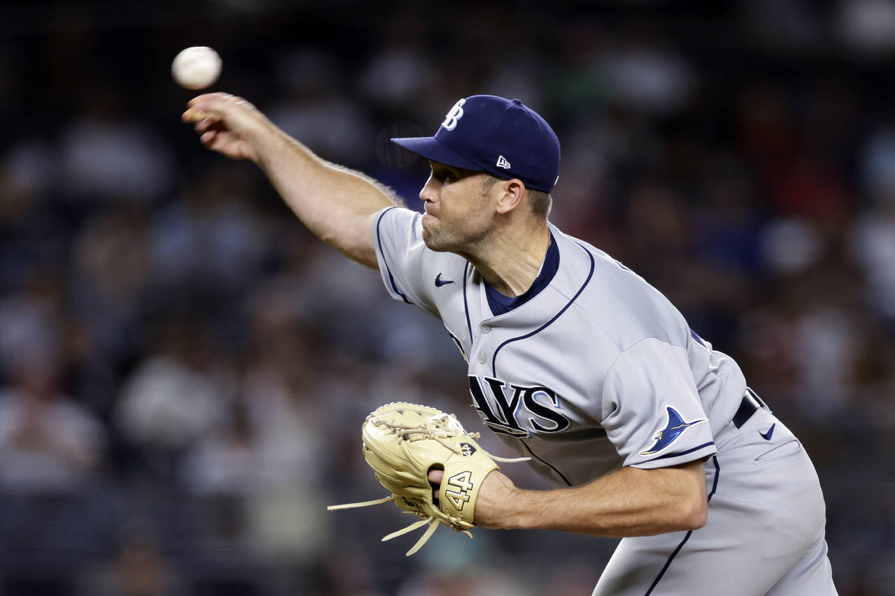FILE -  Tampa Bay Rays pitcher Jason Adam throws during the ninth inning of the team's baseball gam...