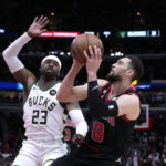Giannis sets assists mark, hurts wrist; Bucks beat Bulls