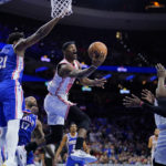 Butler's acrobatic layup, 23 points lead Heat past 76ers