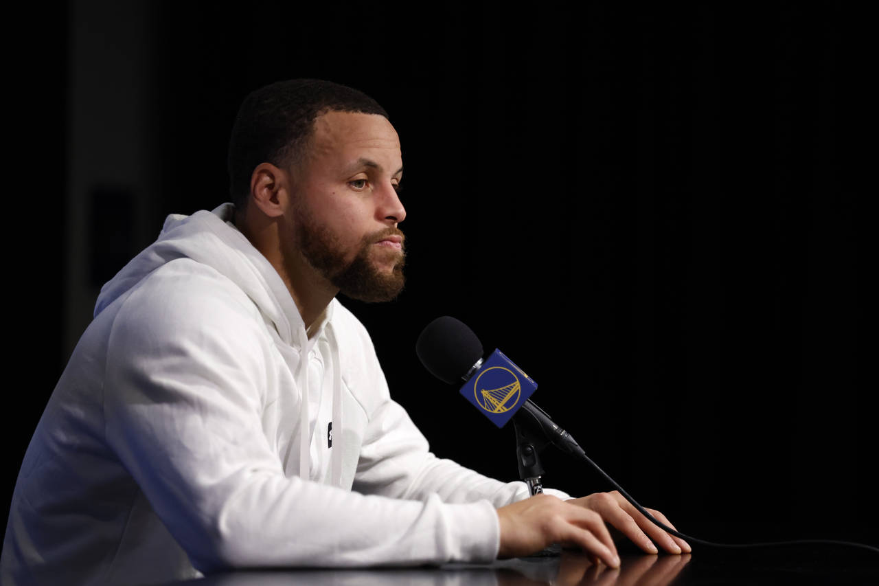 Golden State Warriors' Stephen Curry speaks at a news conference before an NBA basketball game agai...