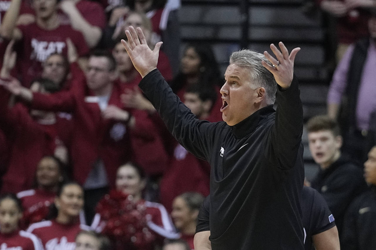 Purdue head coach Matt Painter argues a call during the second of an NCAA college basketball game a...