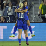 US women beat Canada 2-0, show support in labor dispute