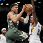 Giannis returns, Bucks beat Nets 118-104 for 15th straight