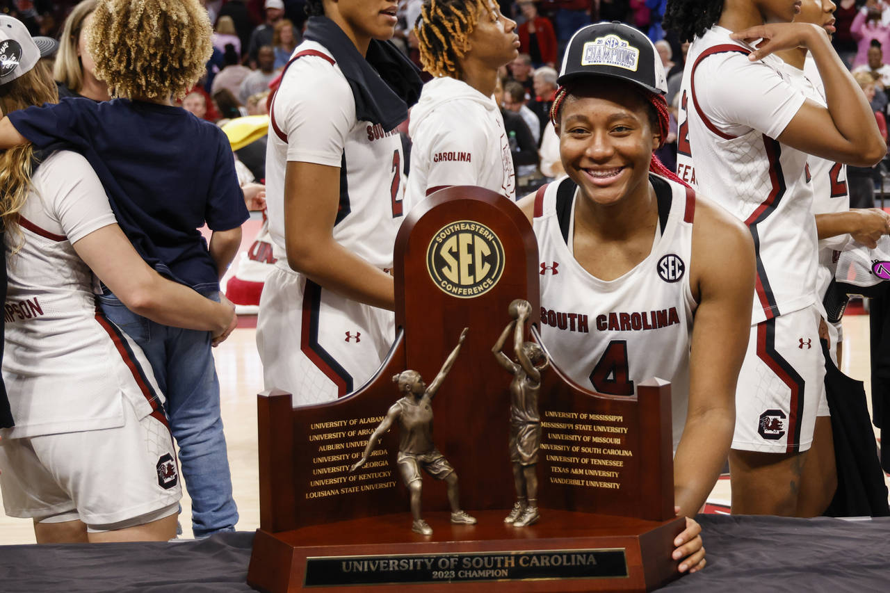 South Carolina forward Aliyah Boston stands with the SEC regular season trophy after South Carolina...