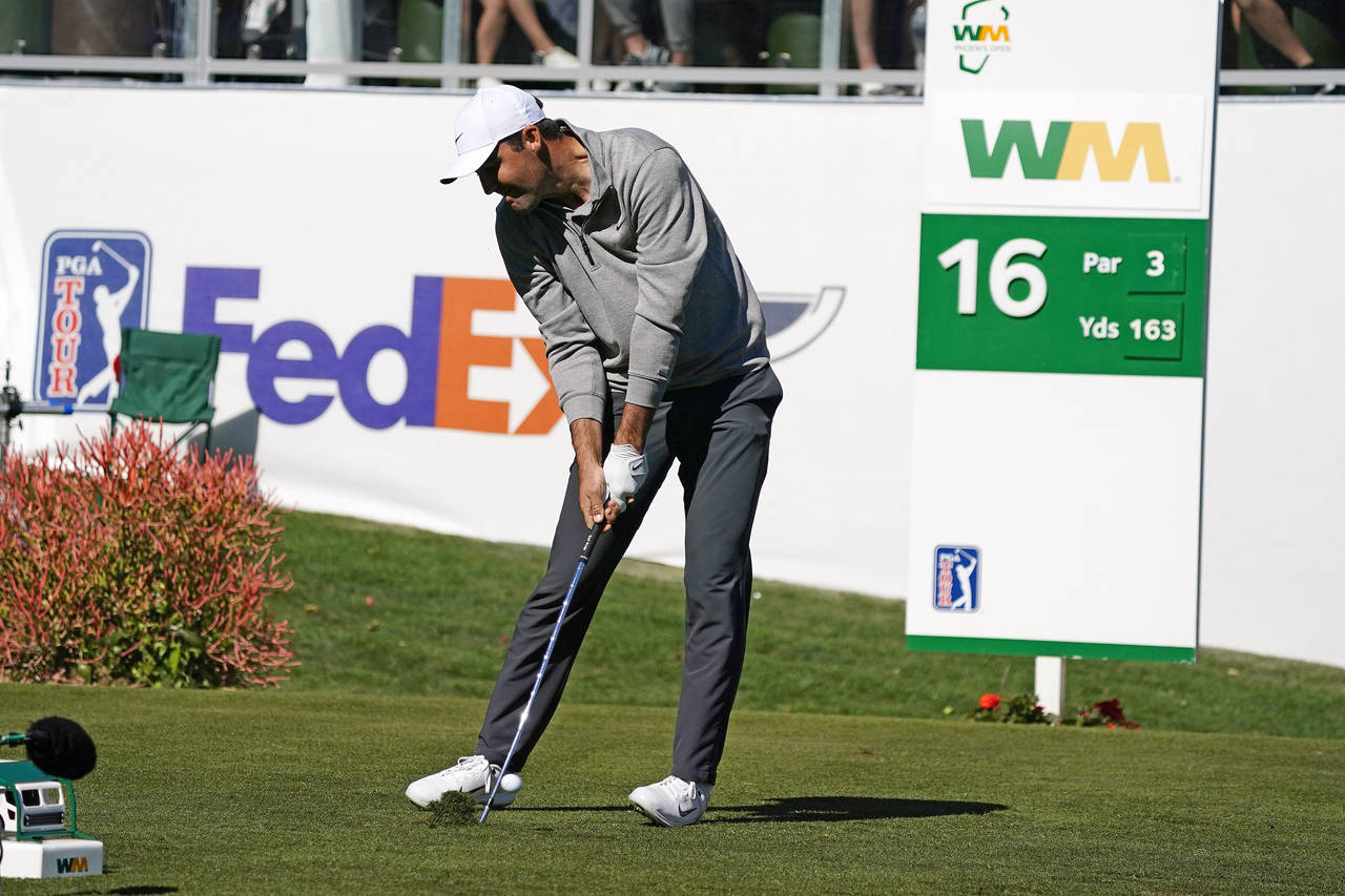 Scottie Scheffler tees off on the 16th hole during the second round of the Phoenix Open golf tourna...