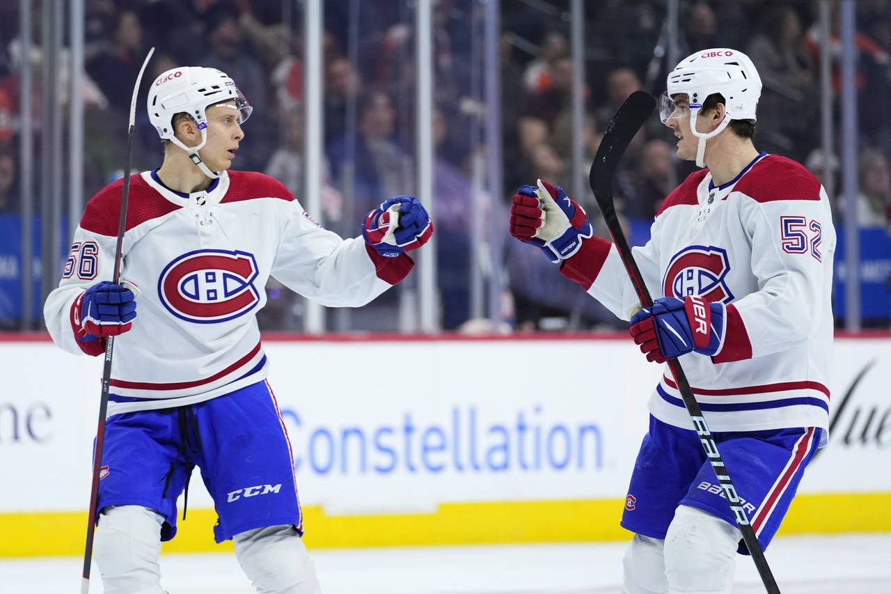 Montreal Canadiens' Jesse Ylonen, left, and Justin Barron celebrate after Ylonen's goal during the ...