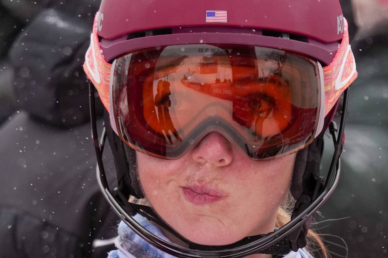 FILE - Mikaela Shiffrin, of the United States, reacts after falling in the women's combined slalom ...