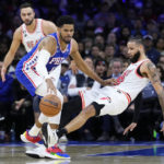 Butler's acrobatic layup, 23 points lead Heat past 76ers