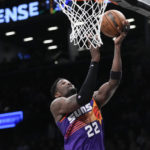 Ayton has 35, Suns hold off Thomas, Nets in Booker's return