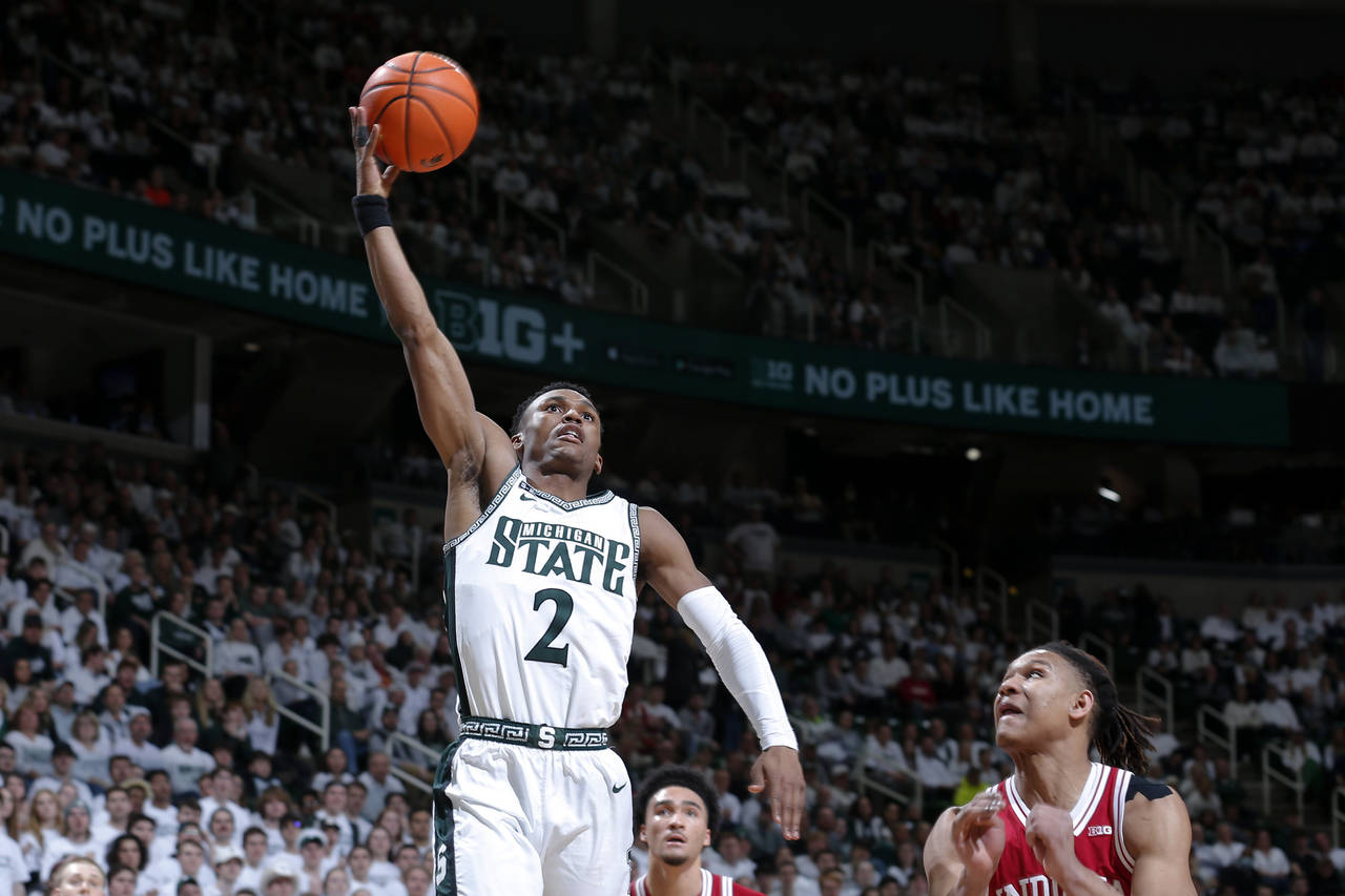 Michigan State's Tyson Walker shoots against Indiana's Malik Reneau during the second half of an NC...