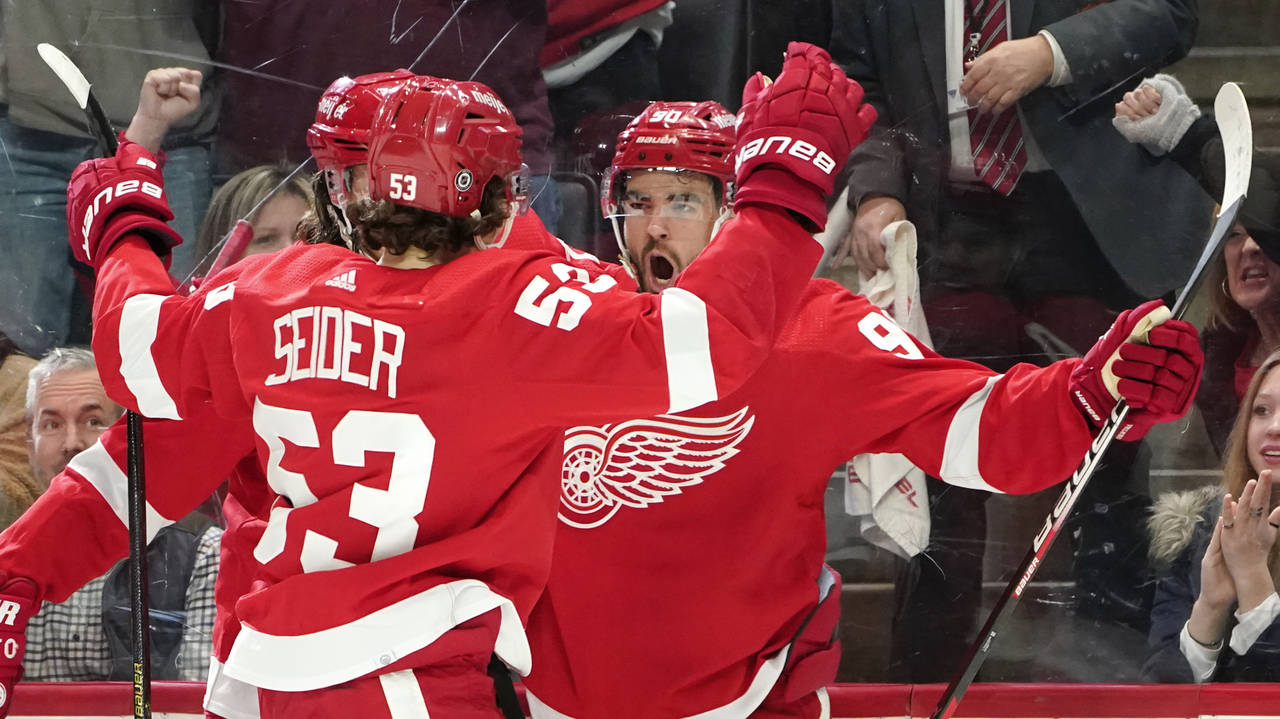 Detroit Red Wings center Joe Veleno, right, celebrates his goal against the Edmonton Oilers in the ...