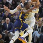 Curry injures left leg leading Warriors over Mavs 119-113