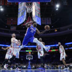Butler's acrobatic layup, 23 points lead Heat past 76ers