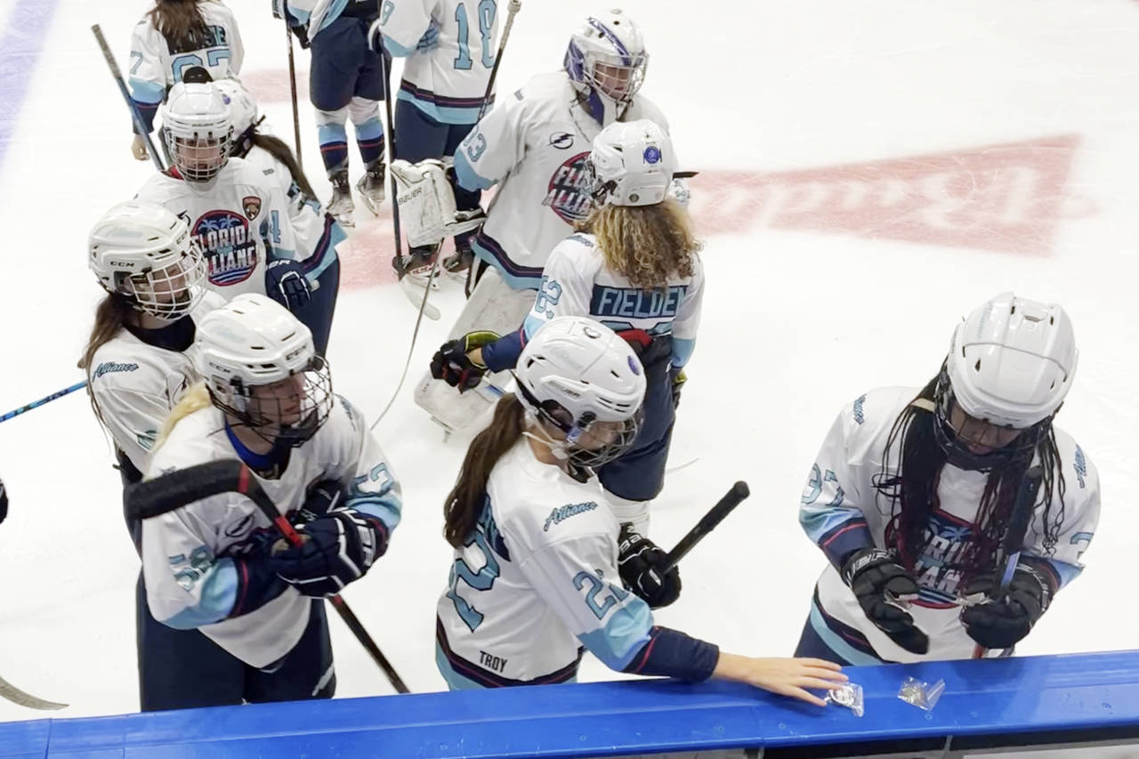 In this image taken from video, members of the Florida Alliance prepare for their hockey game again...
