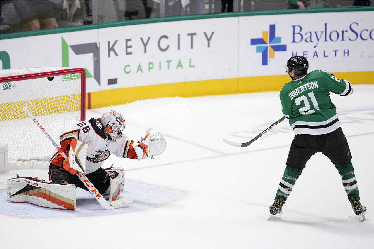Dallas Stars left wing Jason Robertson (21) scores on a shootout-attempt against Anaheim Ducks goal...