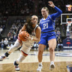 Behind Ducharme, No. 6 UConn rallies past Creighton 62-60