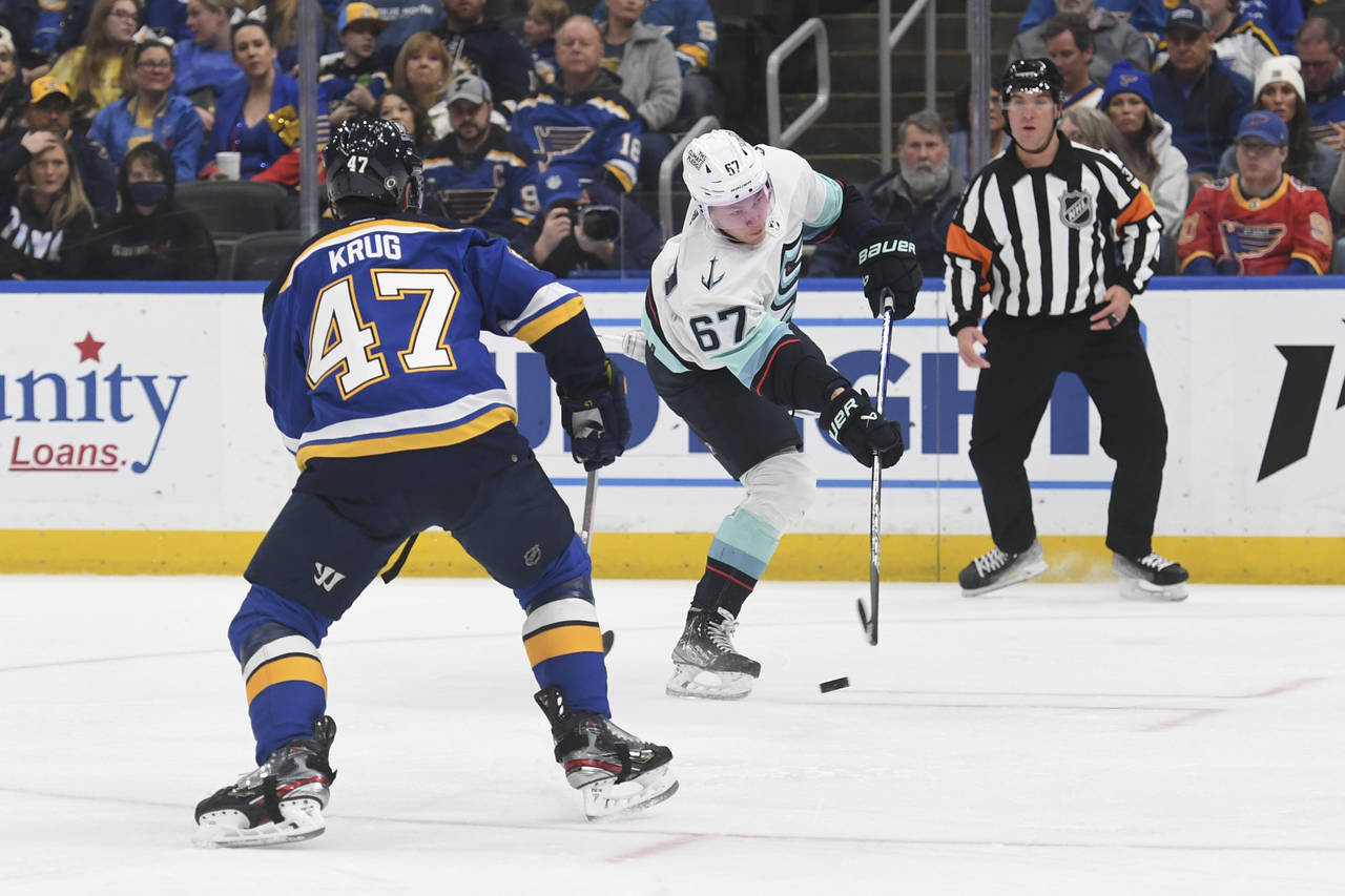Seattle Kraken's Morgan Geekie (67) shoots a goal against St. Louis Blues' Torey Krug (47) during t...