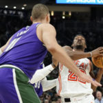 Giannis exits early with knee issue; Bucks rip Heat 128-99