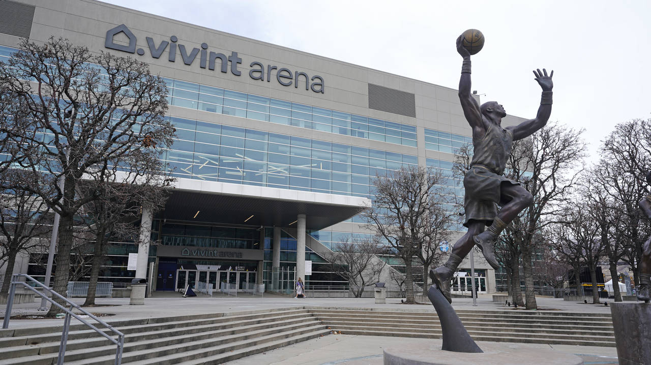 A statue of former Utah Jazz player Karl Malone is shown in front of the Vivint Arena before the st...