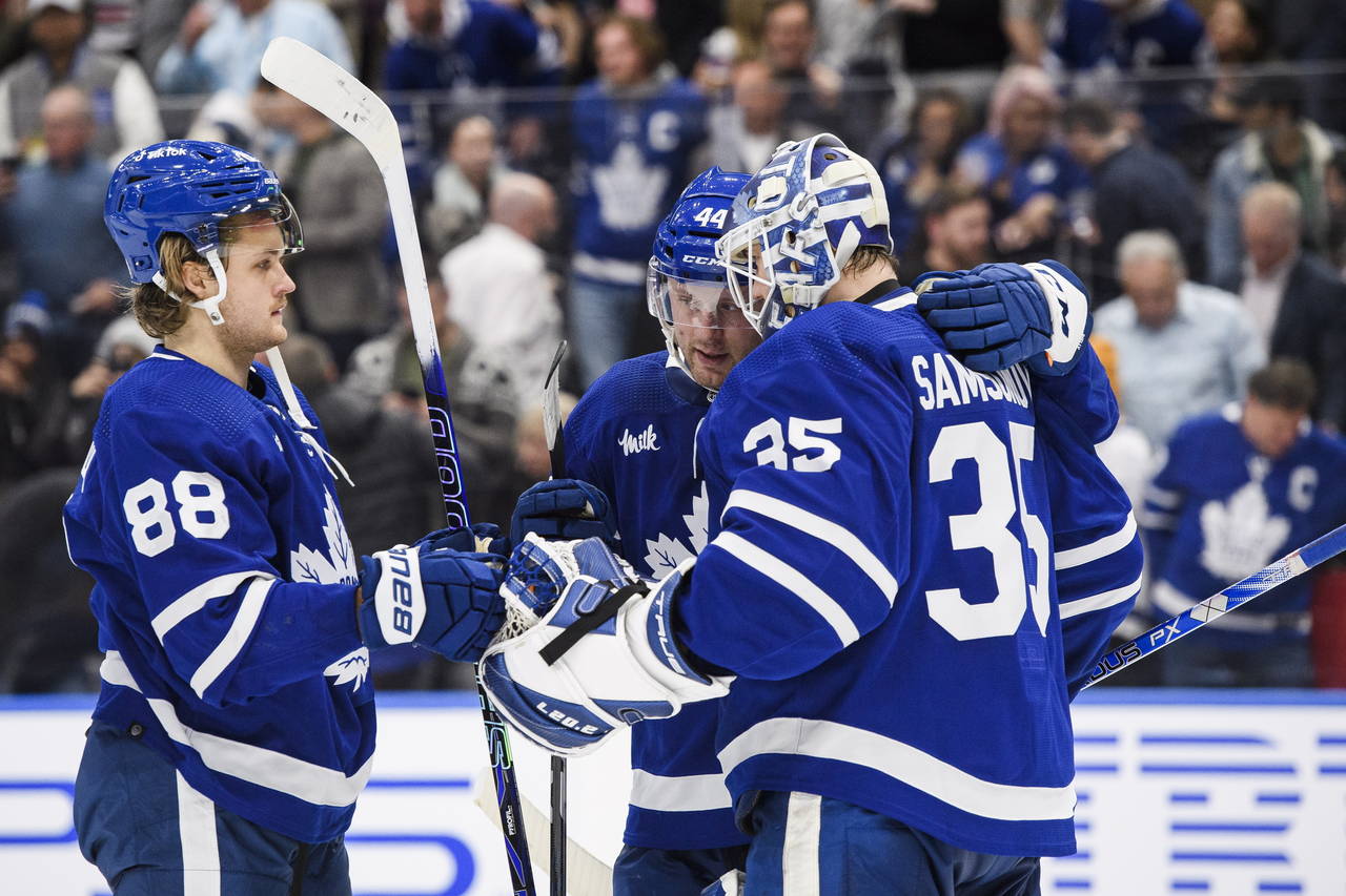 Toronto Maple Leafs right wing William Nylander (88) and defenseman Morgan Rielly (44) celebrate wi...