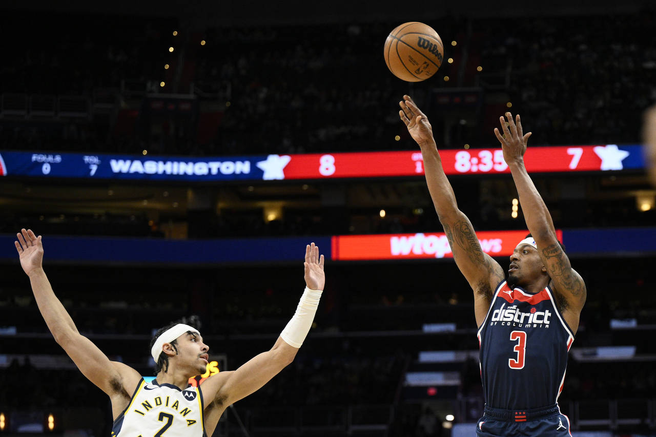 Washington Wizards guard Bradley Beal (3) shoots against Indiana Pacers guard Andrew Nembhard, left...