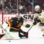 Bruins goaltender Linus Ullmark scores into empty net