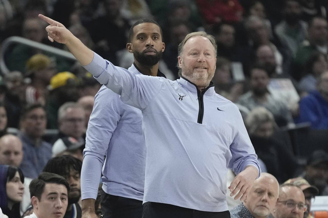 Milwaukee Bucks head coach Mike Budenholzer reacts during the first half of an NBA basketball game ...