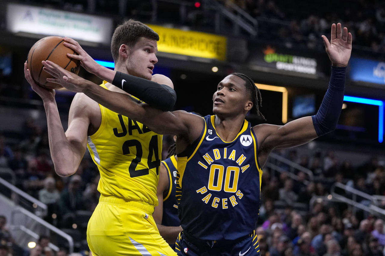Indiana Pacers guard Bennedict Mathurin (00) fouls Utah Jazz center Walker Kessler (24) during the ...