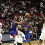 Nikola Jokic scores 27, Nuggets hold off Heat 112-108