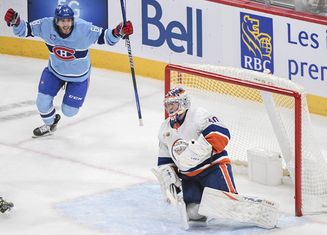 Montreal Canadiens' Mike Hoffman (68) reacts to a goal by teammate Mike Matheson (not shown) agains...