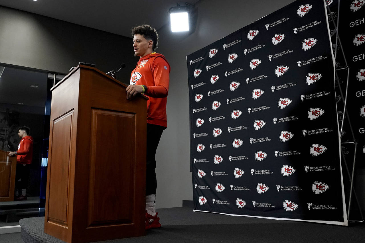 Kansas City Chiefs quarterback Patrick Mahomes talks to the media before an NFL football workout Th...