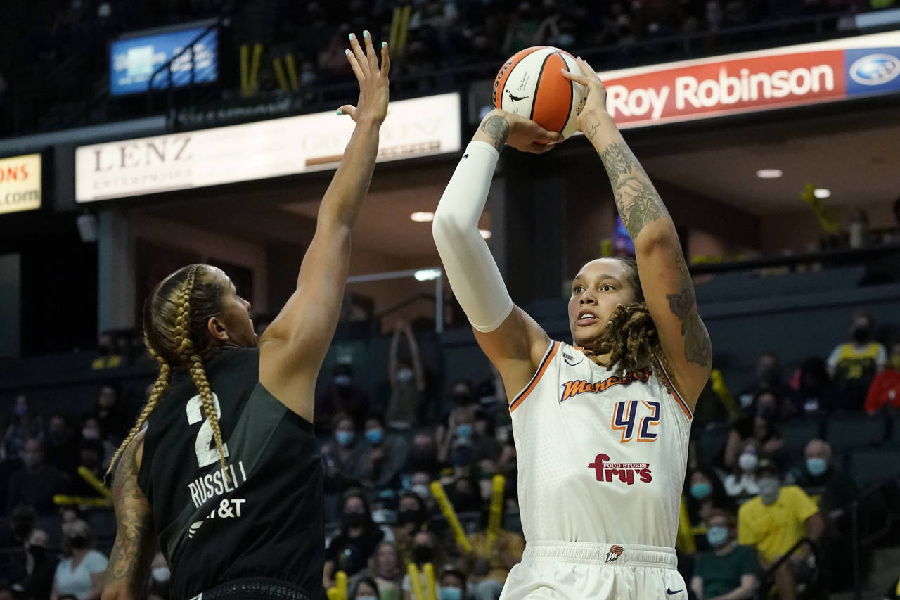 FILE -  Phoenix Mercury's Brittney Griner (42) shoots over Seattle Storm's Mercedes Russell in the ...