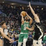 Bucks edge Celtics 131-125 in OT for 11th straight win