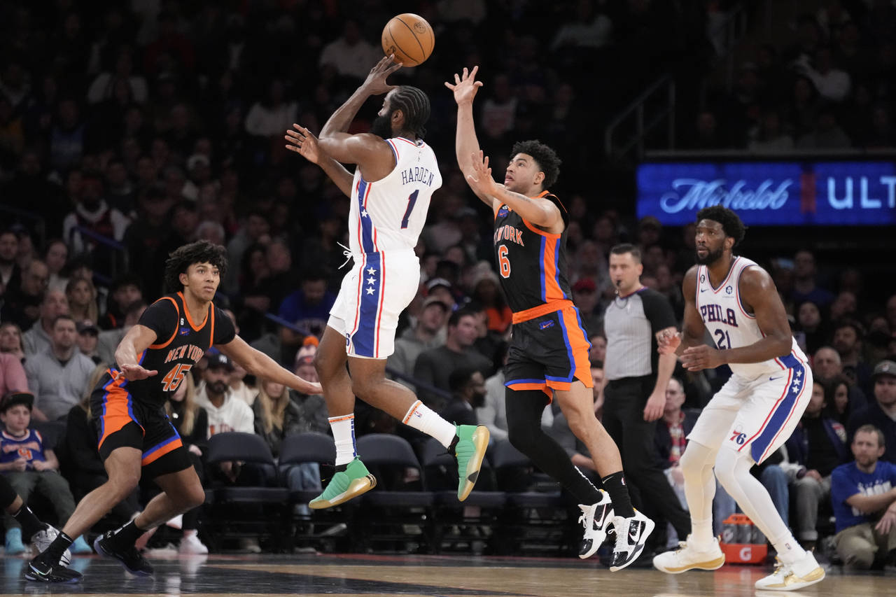 Philadelphia 76ers guard James Harden (1) passes against New York Knicks guard Quentin Grimes (6) d...