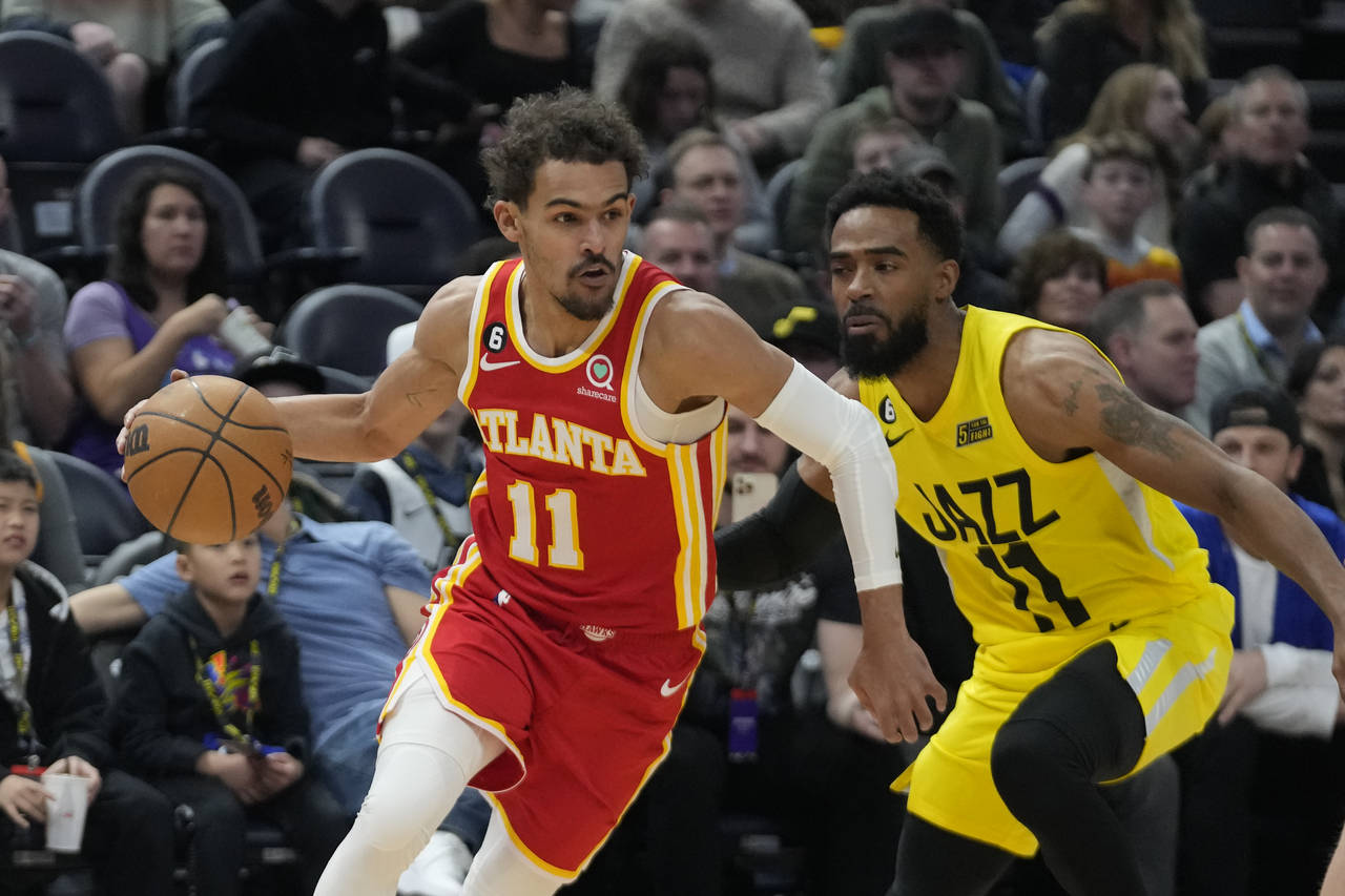 Atlanta Hawks guard Trae Young (11) drives as Utah Jazz guard Mike Conley (11) defends during the f...