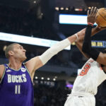 Giannis exits early with knee issue; Bucks rip Heat 128-99