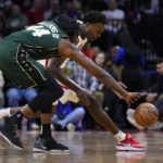 Tatum's late 3 lifts Celtics past Embiid, 76ers 110-107