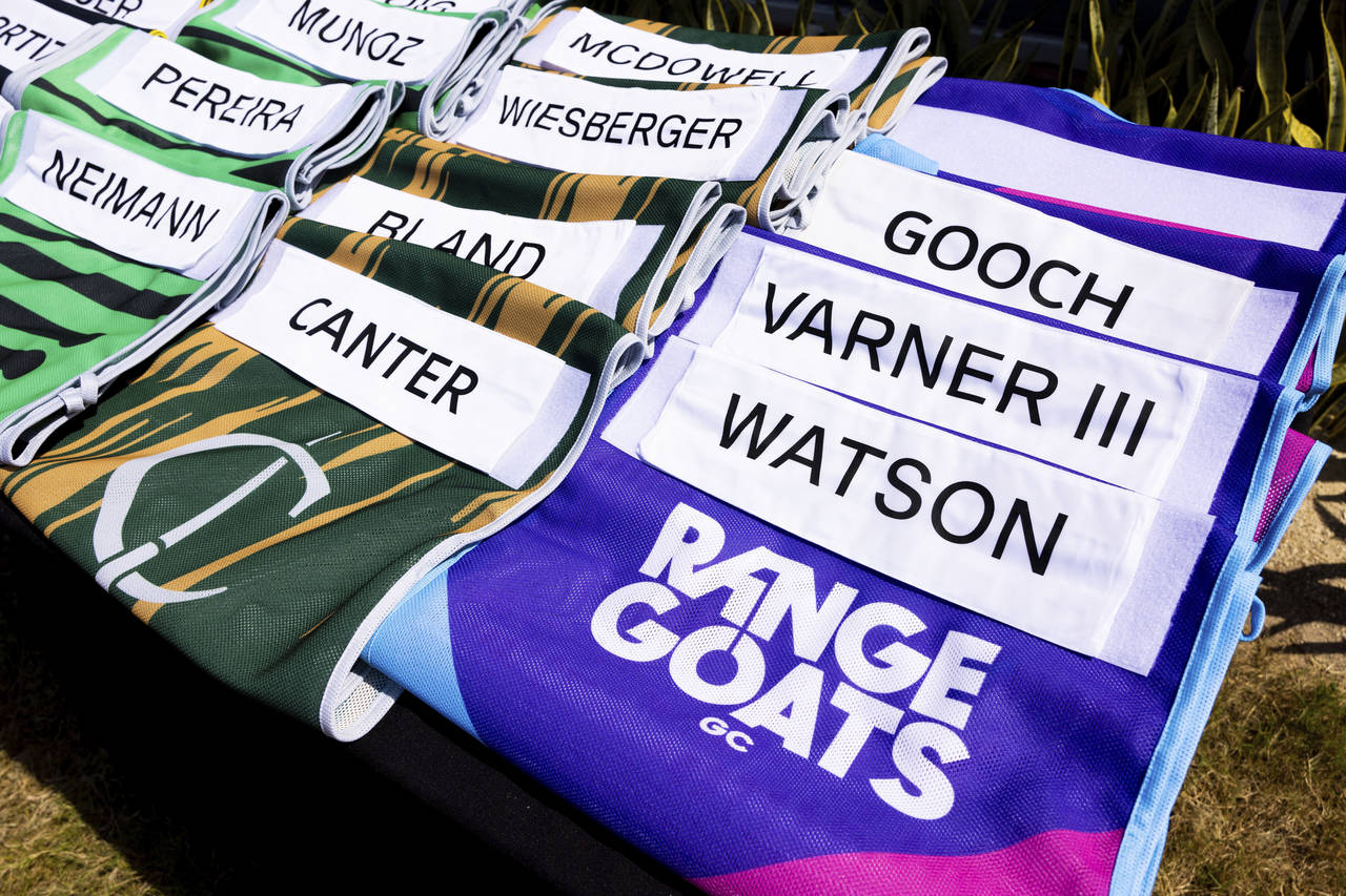 The Cleeks GC and RangeGoats GC LIV Golf team caddie bibs shown on the driving range during the fir...