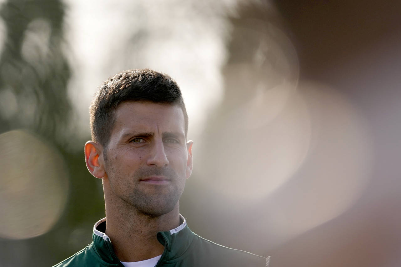 Serbian tennis player Novak Djokovic listens to a question during a press conference after his open...