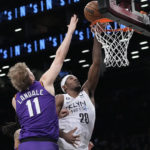 Ayton has 35, Suns hold off Thomas, Nets in Booker's return
