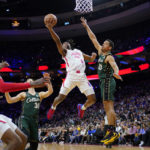 Tatum's late 3 lifts Celtics past Embiid, 76ers 110-107