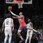 Thomas helps Nets rally from 23 down to beat Wizards 125-123