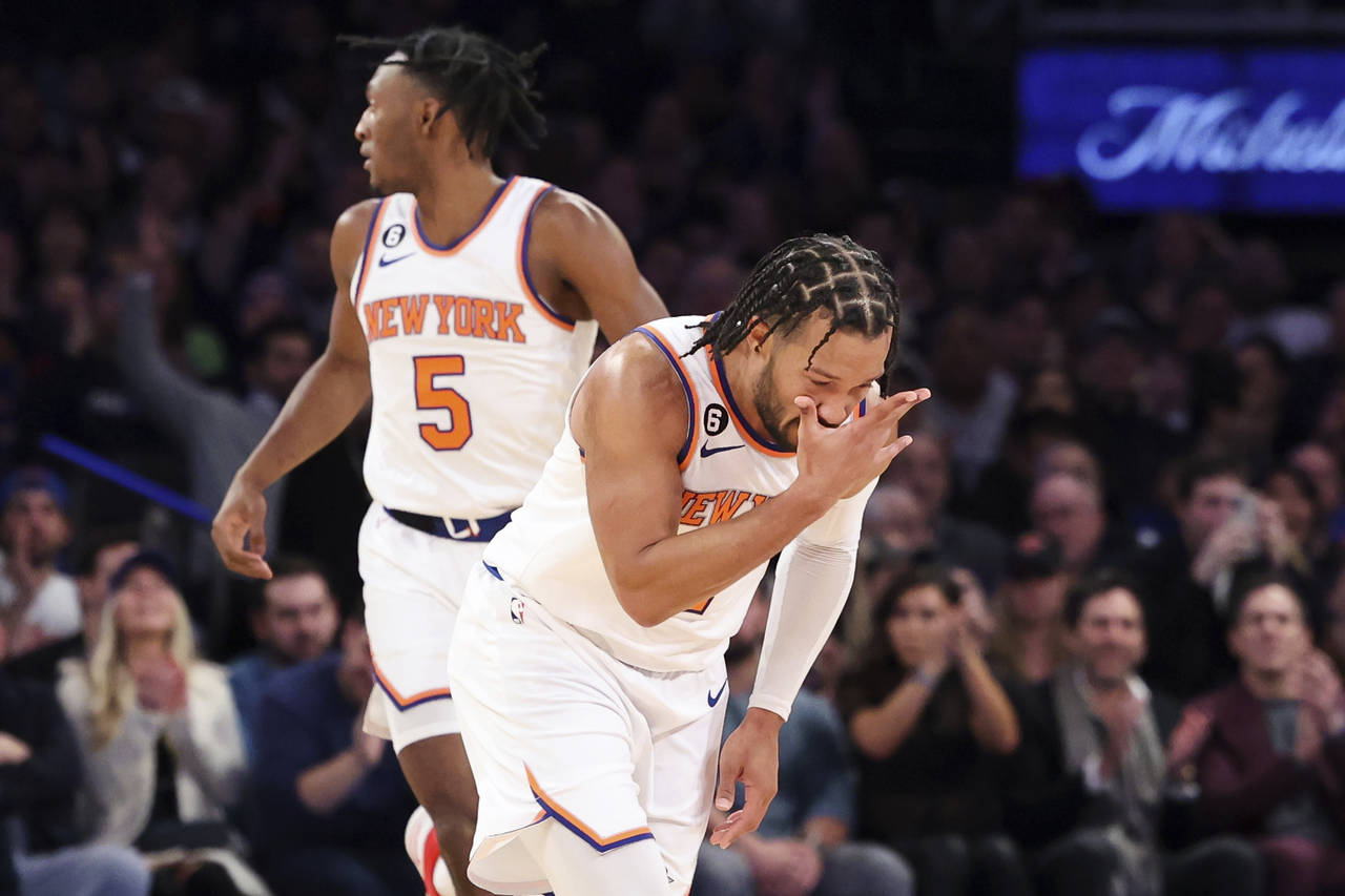New York Knicks guard Jalen Brunson gestures after making a three point shot against the Brooklyn N...
