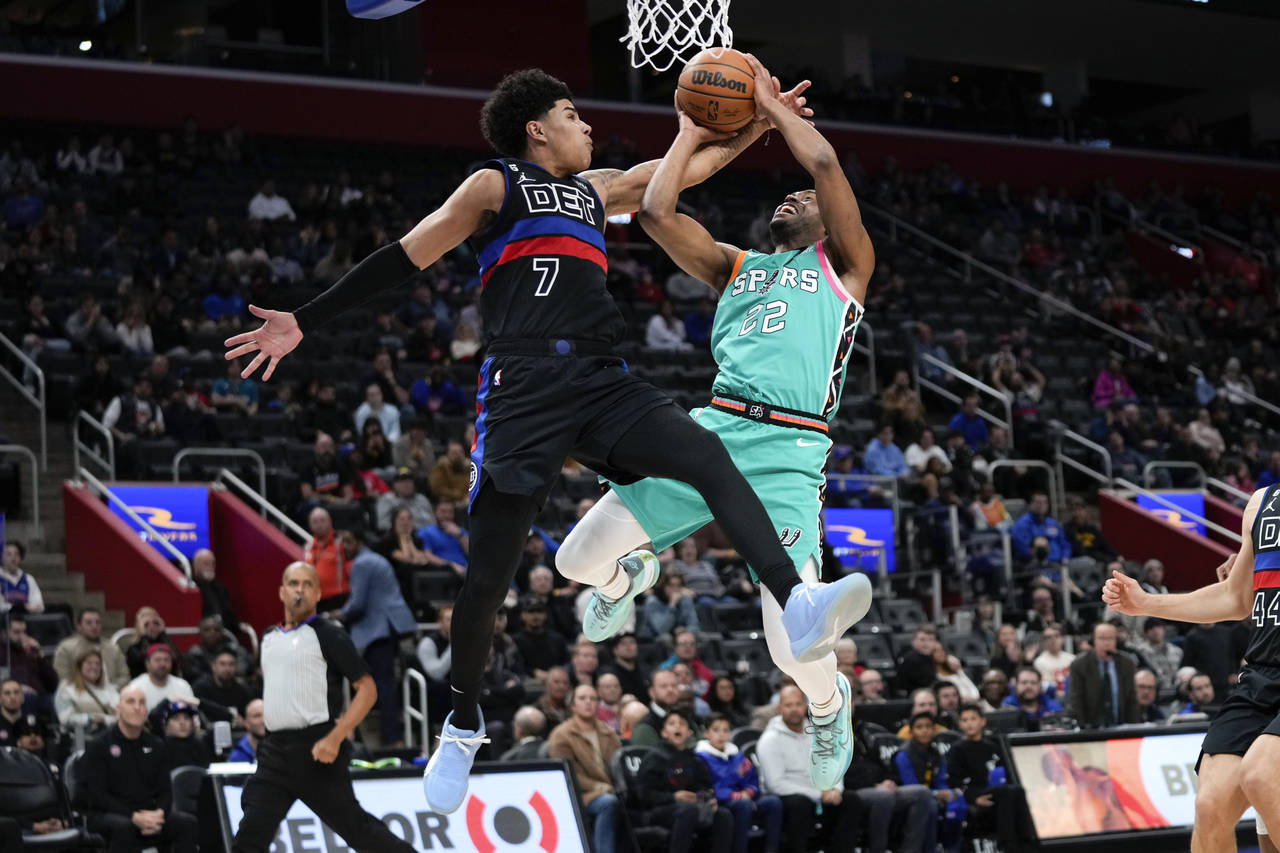 Detroit Pistons guard Killian Hayes (7) fouls San Antonio Spurs guard Malaki Branham (22) during ov...