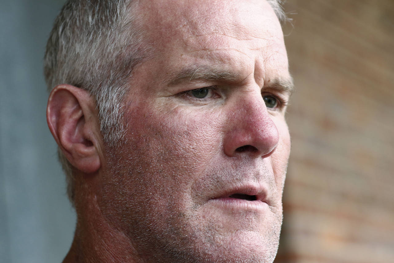 FILE - Former NFL quarterback Brett Favre speaks to the media in Jackson, Miss., Oct. 17, 2018. Fav...