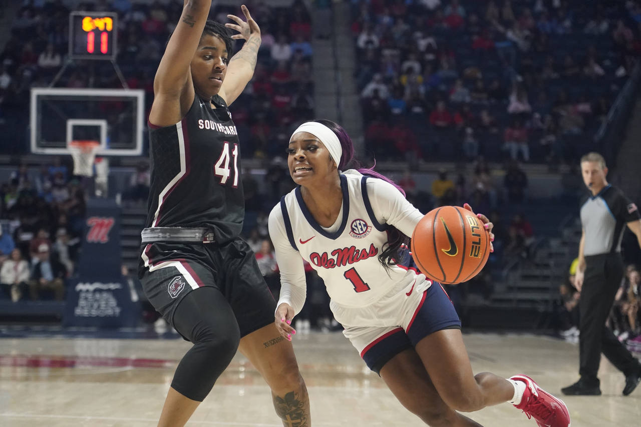 Mississippi guard Myah Taylor (1) attempts to dribble past the defense of South Carolina guard Kier...