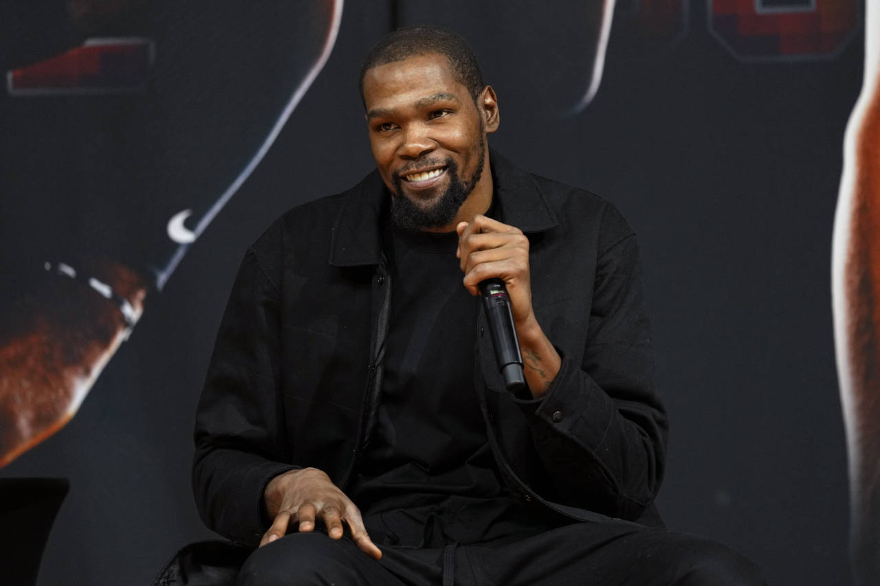 Phoenix Suns forward Kevin Durant, speaks to the media after being introduced during an NBA basketb...